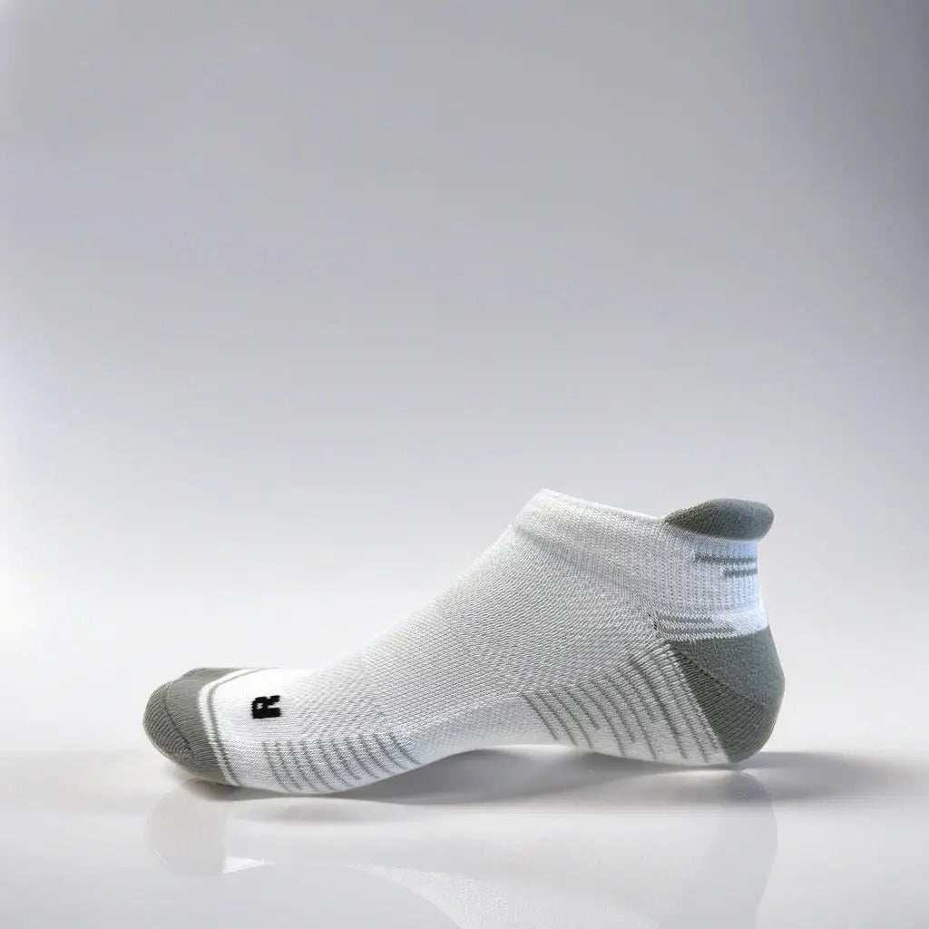 Low cut white and grey running socks with arch support and ventilation.