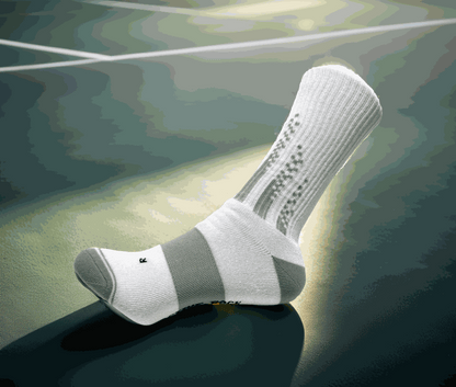 Padel crew sock on court, showcasing grip and cushioning features.